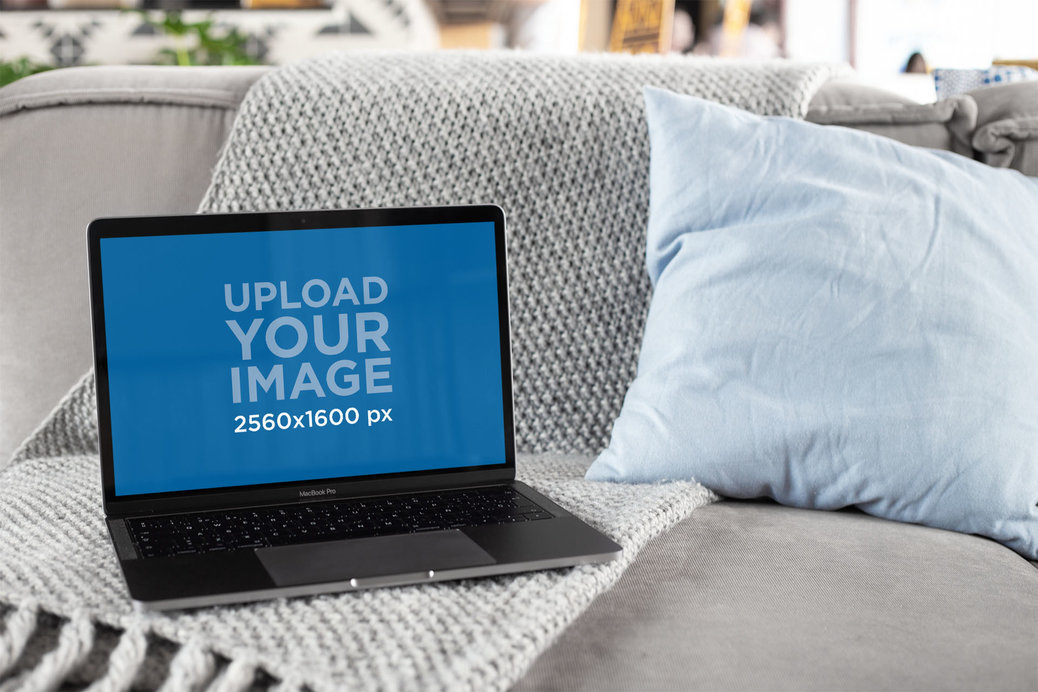 MacBook Mockup Featuring a House Environment