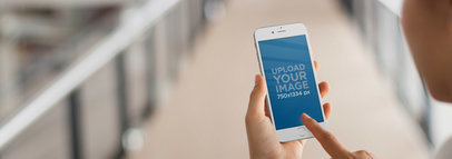 Mockup Template of a Young Woman Using Her iPhone at a Ramp