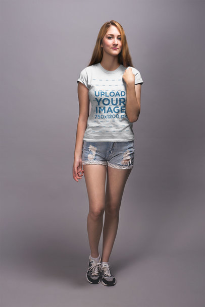 Mockup of a Blonde Woman Wearing a T-Shirt and Denim Shorts