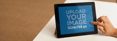 Tablet Mockup of a Young Woman Using Her iPad at the Office