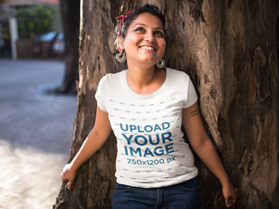 Mockup of a Happy Woman Wearing a Tshirt Against a Tree