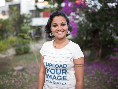 Mockup of a Woman Wearing a T-Shirt at a Park