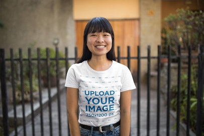 Tshirt Mockup Featuring a Happy Woman Outside her House