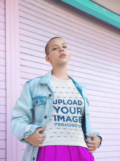 T-Shirt Mockup of a Woman with Short Hair Wearing a Pink Skirt and a Denim Jacket