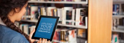 iPad Mockup Featuring a Woman at the Library