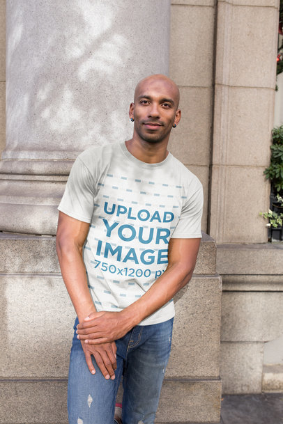 Round Neck Tshirt Mockup Featuring a Man Leaning Against a Column
