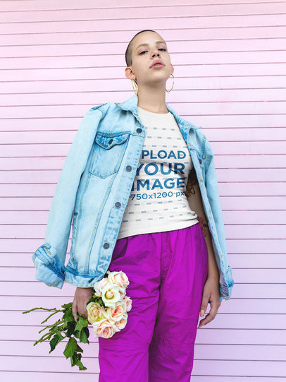 Mockup of a Short-Haired Woman Wearing a T-Shirt Holding Flowers