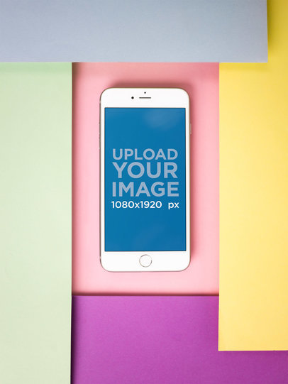 iPhone 8 Plus Mockup Lying Between Color Papers
