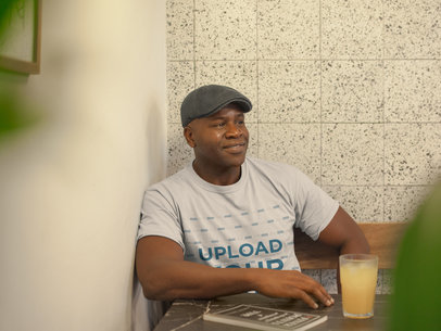 Mockup of a Man Wearing a Round Neck Tee and a Gray Beret