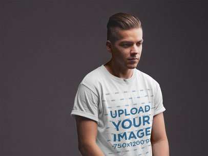  Mockup Featuring a Stylish Young Man Wearing a  T Shirt Against a Dark Gray Background