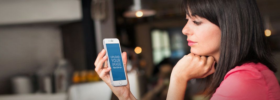 iPhone 6 Mockup Template of a Woman Waiting at a Restaurant
