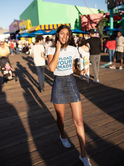 Tshirt Mockup of a Happy Woman Outside an Amusement Park