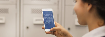 Mockup of a Young Girl at School Using White iPhone 6