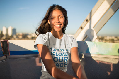 Mockup of a Happy Woman Wearing a Tshirt at a Ferris Wheel Cabin