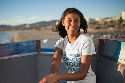 Tshirt Mockup of a Woman Sitting on a Ferris Wheel Cabin