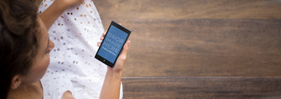 Windows Phone Mockup Featuring a Woman Sitting on Wooden Stairs