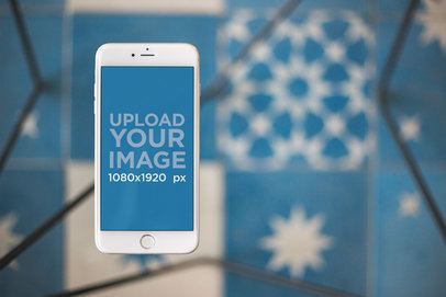 Silver iPhone 8 Plus Mockup Floating Against Blue Tiles