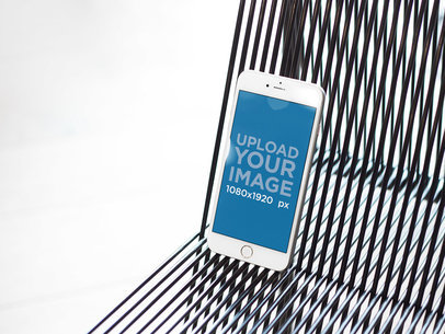 iPhone Mockup Standing on Black Vinyl Cord 21625