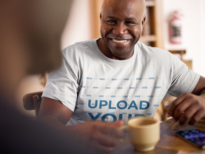 T-Shirt Mockup Featuring a Man Smiling