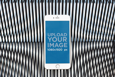 iPhone Mockup Floating Against a Patterned Black Vinyl Cord Background 21626