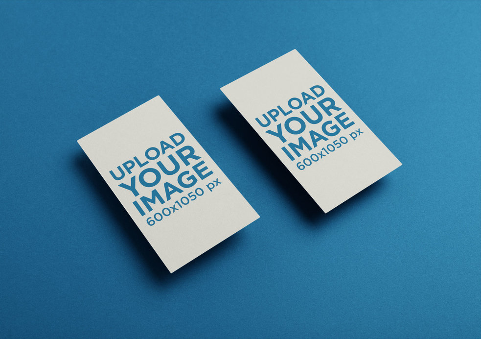 Two Vertical Business Cards Mockup Floating Over a Solid Surface
