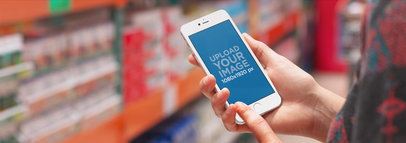 White iPhone Mockup Featuring a Woman at the Supermarket