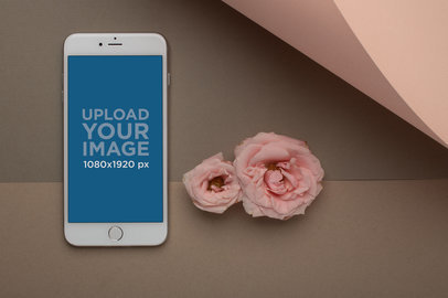 iPhone Mockup Standing Next to Two Roses