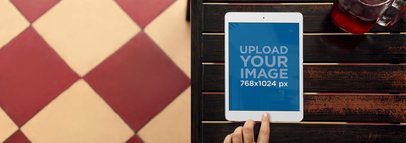 Tablet Mockup of an iPad Lying Over a Wood Table