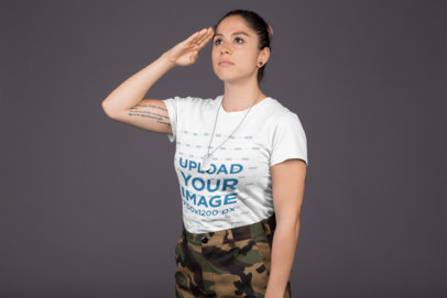 Mockup of a Woman Wearing a T-Shirt and Military Clothing while Saluting