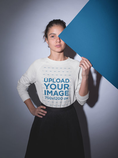 Sweater Mockup of a Girl Holding a Pasteboard Against her Face 18511