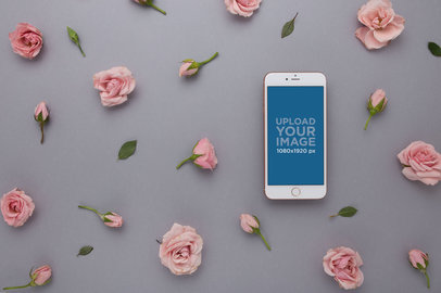 iPhone Mockup Lying with Pink Roses Heads and Leaves