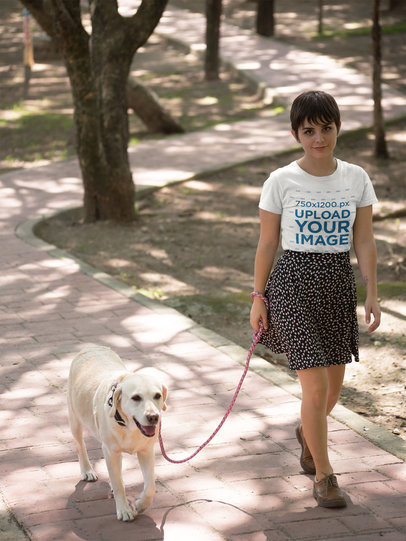 T-Shirt Mockup of a Woman Walking Her Dog