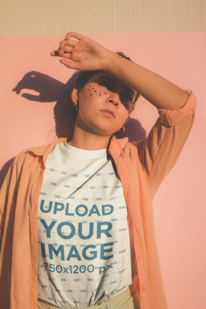 Mid Shot Crewneck Tee Mockup of a Woman with Star Glitter on Her Face Covering from the Sun