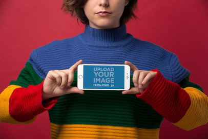 Mockup Featuring a Short-Haired Woman Wearing Winter Clothing Holding an iPhone 8 Plus in Landscape Position 21827
