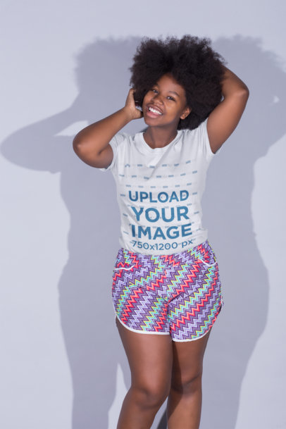 Mockup of a Smiling Woman Wearing a T-Shirt