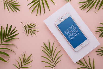 Gold iPhone 8 Plus Mockup Lying Angled Surrounded by Leaves