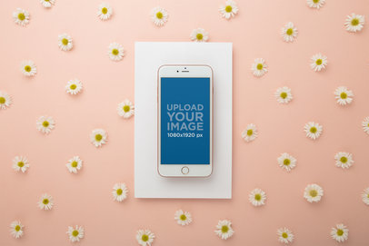 Mockup Featuring an iPhone on a White Cardboard Over a Surface with Chamomile Flowers 21973