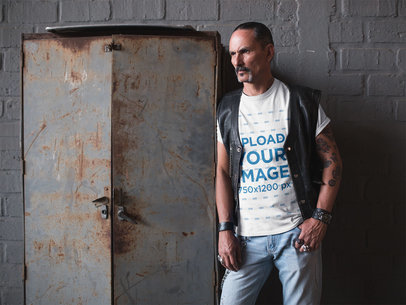 T-Shirt Mockup of a Biker Leaning on a Rusty Storage Cabinet 20251