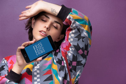 iPhone 8 Plus Mockup of a Woman Closing Her Eyes in Front of a Purple Background 21835