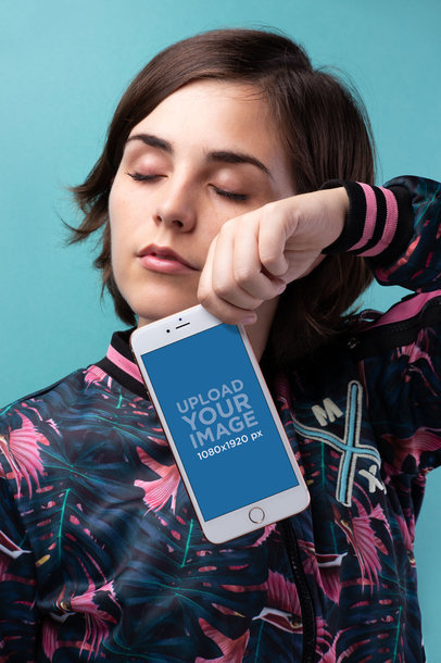 Mockup of a Gold iPhone 8 Plus Hanging from a Woman's Hand