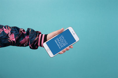 Mockup of a Colorfully Dressed Arm Holding a Gold iPhone 8 Plus 21846
