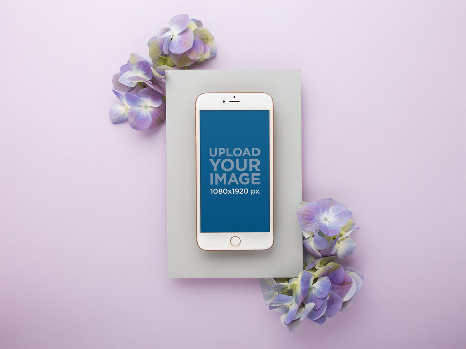 iPhone Mockup on Gray Paper over a Purple Background with Hydrangea Lilac Flowers