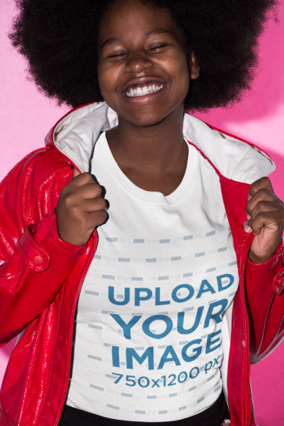 T-Shirt Mockup Featuring a Smiling Woman with Afro Hair Wearing a Red Raincoat