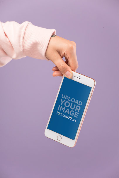 Gold iPhone 8 Plus Mockup Held by an Arm in a Pale Pink Sleeve 21967