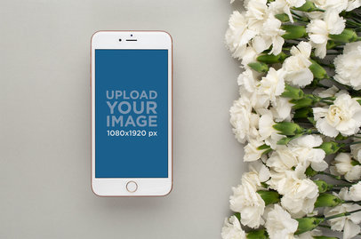 Gold iPhone 8 Plus Mockup Lying Next to White Flowers