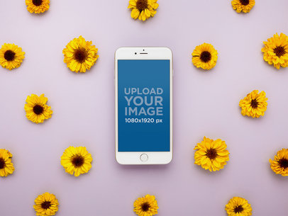 Mockup of a Silver iPhone 8 Surrounded by Sunflowers