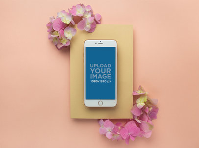 iPhone 8 Plus Mockup on a Yellow Cardboard with Pink Flowers