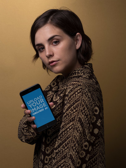 Space Grey iPhone 8 Plus Mockup Held by a Woman in Front of a Brown Background 21852