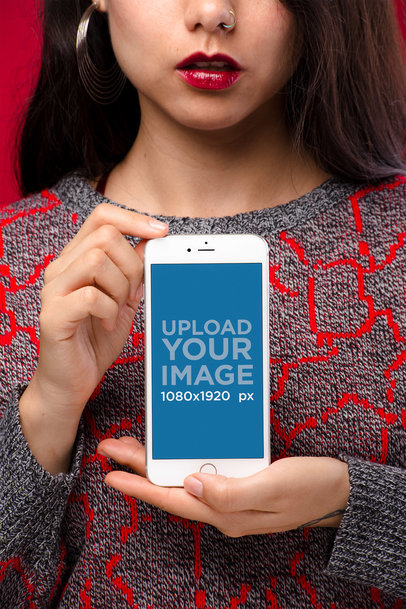 Mockup of a Girl with a Crewneck Embroidered Sweater and a Nose Piercing Holding a Silver iPhone 8 Plus 21960
