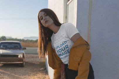 T-Shirt Mockup Featuring a Woman Wearing a Mustard Yellow Jacket